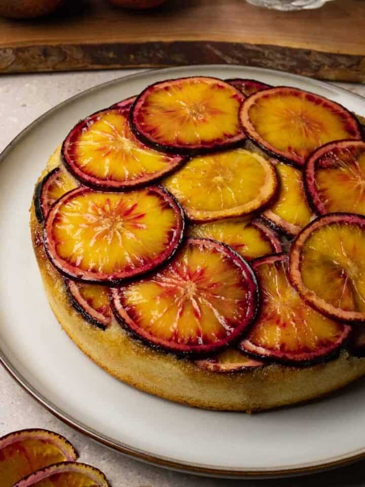 Cake topped with blood orange slices.