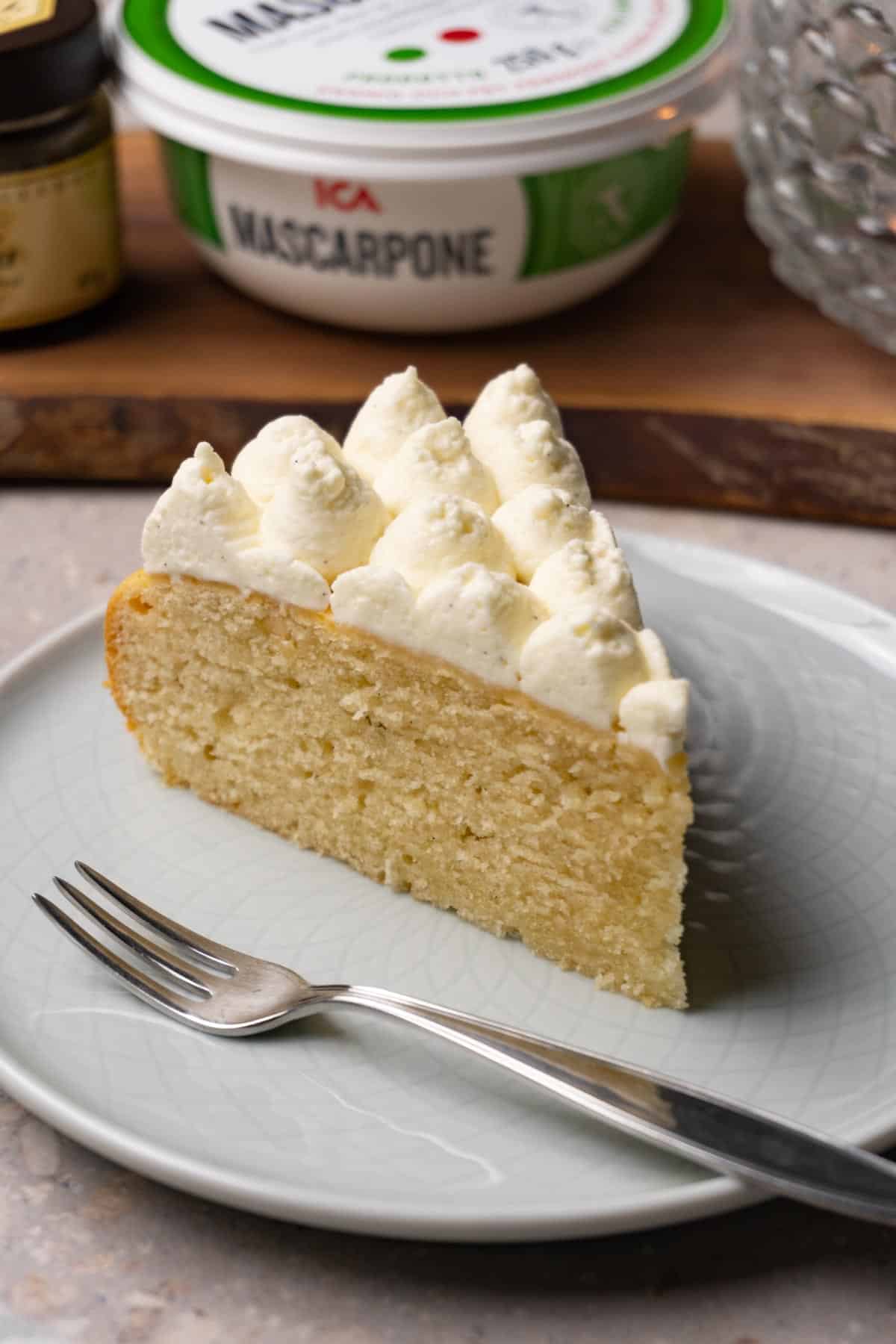 A piece of one-layer cake with frosting piped on top.
